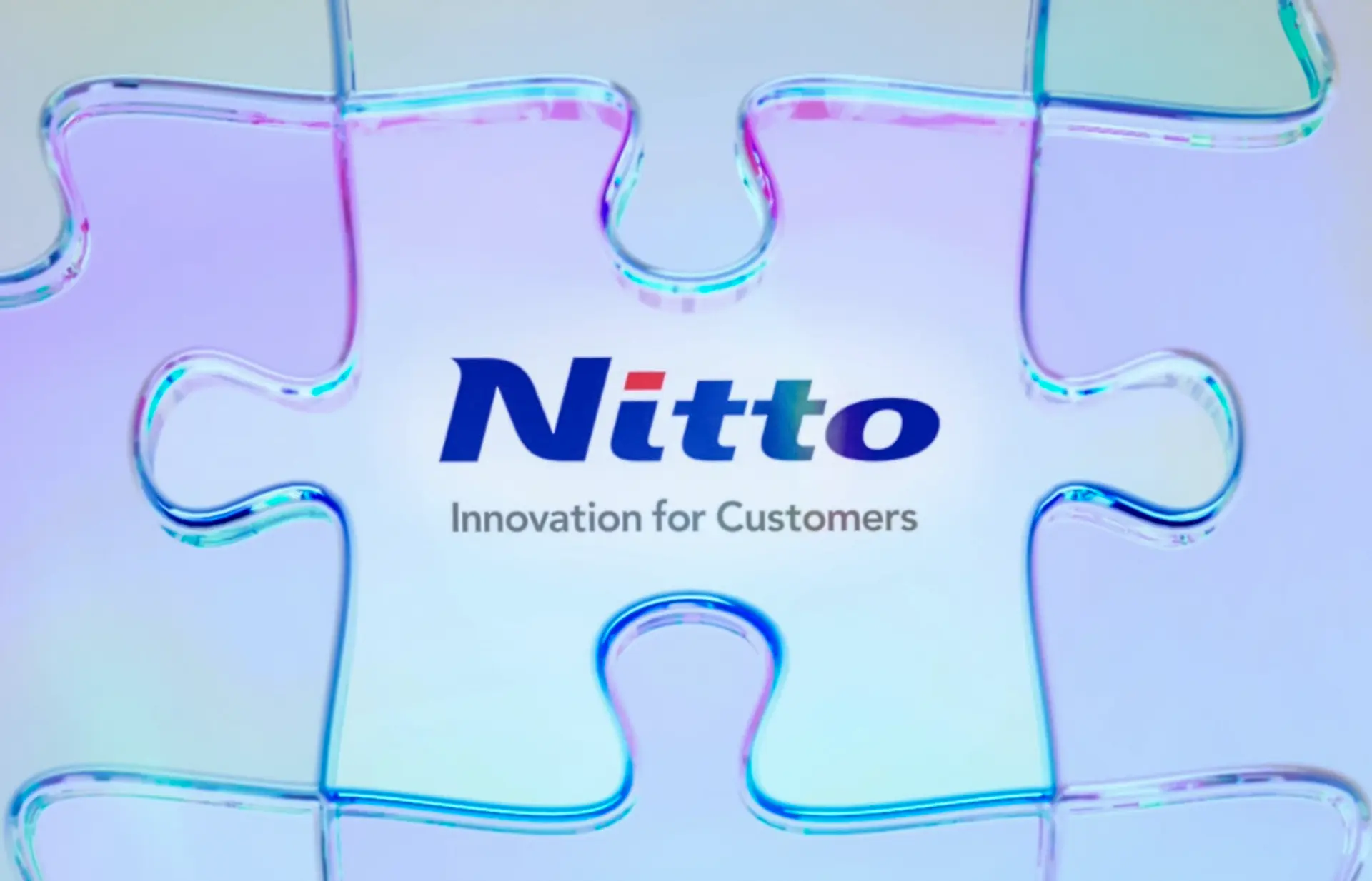 中期経営計画「Nitto for Everyone 2025」を表現した、パズルの中心にNittoロゴを配置した画像